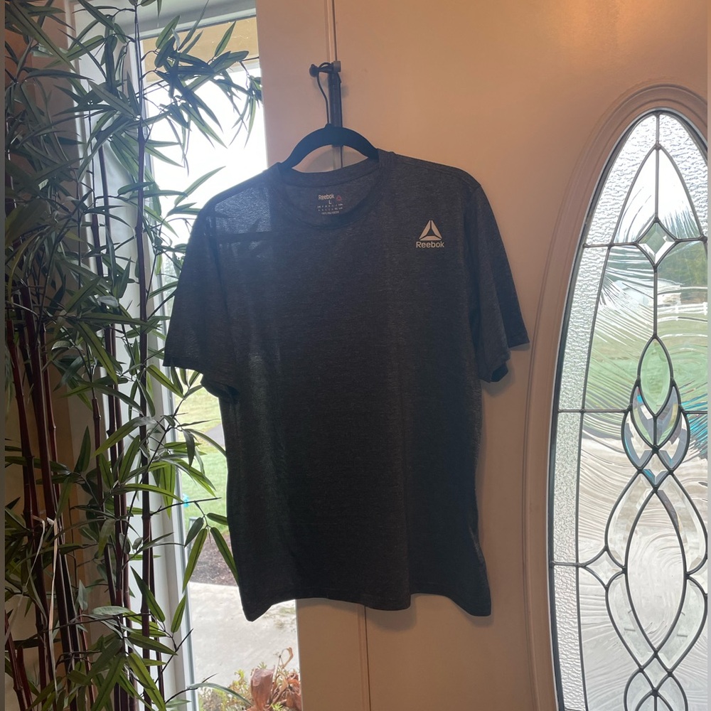 Reebok women’s workout shirt size large.